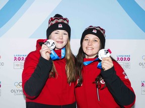 Canada's Caitlin Nash, left, and Natalie Corless celebrate their second-place finish in the Lausanne 2020 Winter Youth Olympics women's doubles-luge event on Jan. 18 in St. Moritz, Switzerland.