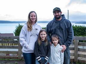Natasha and Chad Woo, with their daughters Peyton, 8, and Brianna, 6, at their home in Hyde Creek, near Port McNeill.