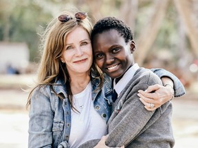 Lotte Davis, founder of One Girl Can, pictured with a student, Queenter, from one of their partner schools, Siakago.