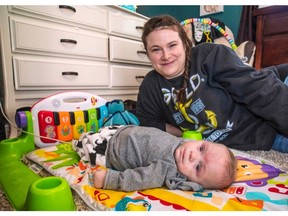 Brooke Roberts and her son Declan relax at their Barnhartvale home.