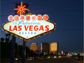 Traffic passes by the famous sign welcoming motorists on the south end of the Las Vegas Strip.