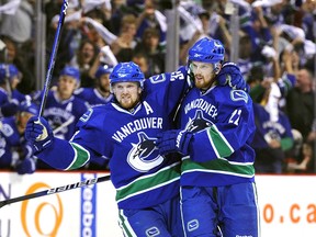 Henrik (left) and Daniel Sedin celebrate a goal during a playoff game against the visiting Chicago Blackhawks in the 2009-10 NHL season. Henrik’s Art Ross Trophy-winning season of 112 points came with Daniel absent 18 games due to injury.