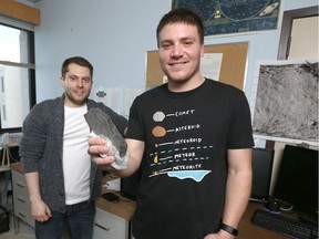 Research assistant Lincoln Hanton (L) and Fabio CIceri. PhD student in Planetary Science and teaching assistant, pose with a meteorite sample at their University of Calgary offices on {ipcdow}, February 12, 2020. The sample is from the Buzzard Coulee Meteorite found in Saskatchewan in 2008. Reasearchers are investating the recent fireball over Calgary. Jim Wells/Postmedia