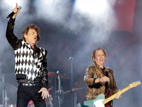 Mick Jagger (C) and Keith Richards of the Rolling Stones perform as they resume their "No Filter Tour" North American Tour at the Soldier Field on June 21, 2019 in Chicago.