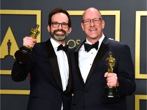 Film editorS Andrew Buckland (L) and Michael McCusker pose with the award for Best Film Editing for Ford vs. Ferrari in the press room during the 92nd Oscars at the Dolby Theater in Hollywood, California on February 9, 2020.