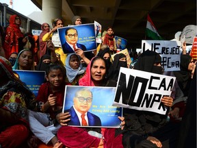 Demonstrators shout slogans during a protest against the Indian government's Citizenship Amendment Act (CAA) and the National Register of Citizens (NRC) at Jaffrabad area in New Delhi on February 23, 2020.