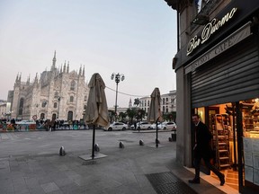 A bar next to the Piazza del Duomo in central Milan closes at 6 p.m. on Feb. 24, 2020, following security measures taken in northern Italy against the coronavirus.