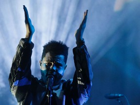 The Weeknd play at the end of the H&M STUDIO SS17 Spring-Summer 2017 ready-to-wear collection fashion show on March 1, 2017 in Paris.