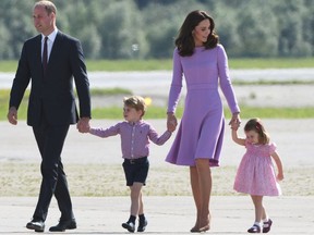 This file photo taken on July 21, 2017 shows Britain's Prince William, Duke of Cambridge and his wife Kate, the Duchess of Cambridge, and their children Prince George and Princess Charlotte on the tarmac of the Airbus compound in Hamburg, northern Germany.
