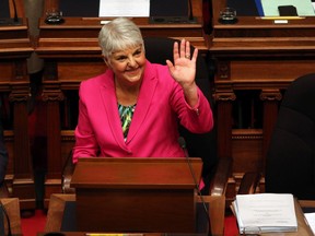 B.C. Minister of Finance Carole James waves to people in the sitting area before she delivers her budget speech from the legislative assembly at the B.C. Legislature in Victoria on Tuesday, Feb. 18.