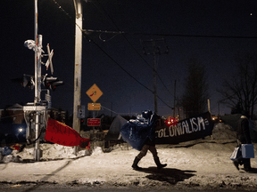 Protesters decamp at a railway blockade in St Lambert, Que., on Feb. 21, 2020.