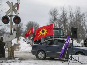 Protesters against the Coastal GasLink pipeline demonstrate at a rail crossing east of Belleville, Ont.