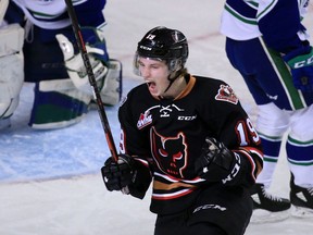 Calgary Hitmen centre Carson Focht, celebrating a goal, has a fan in Hitmen GM Jeff Chynoweth for his ‘compete and battle.’