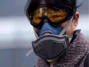 A woman wearing a mask is seen at a subway station in Shanghai, China, as the country is hit by an outbreak of the novel coronavirus, February 13, 2020. REUTERS/Aly Song