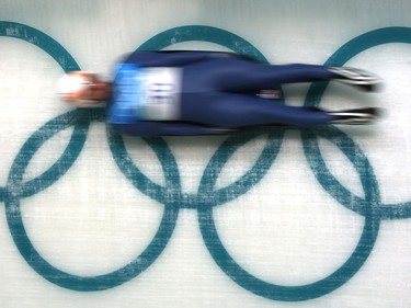 FILE -- WHISTLER, BC.: FEBRUARY 10, 2010 -- Luge participant Nodar Kumaritashvili of Georgia blazes past the Olympic rings during training at The Whistler Sliding Centre in preparation for the 2010 Vancouver Olympic Games in this February 10, 2010 file photo. Nodar Kumaritashvili died in a training accident Friday February 12, 2010.  (Peter J. Thompson / Canwest News Service)   CNS-OLY-LUGE-MEN