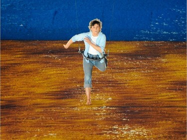 A boy flies around BC Place Stadium during the  opening ceremony for the 2010 Winter Olympic Games in Vancouver February 12, 2010.  (Ric Ernst / Canwest News Service).  CNS-OLY-OPEN