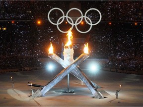 The Olympic Cauldron is lit up in BC Place Stadium by Wayne Gretzky, Nancy Greene-Raine, Steve Nash and Catrina LeMay Doan during the opening ceremony for the 2010 Winter Olympic Games in Vancouver February 12, 2010.