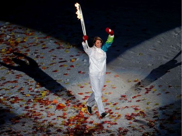 Katrina Lemay Doan carries the torch at the opening ceremony of the 2010 Winter Olympic Games held at B.C. Place in Vancouver February 12, 2010. (Photo by Larry Wong/Canwest News Service) CNS-OLY-OPEN [PNG Merlin Archive]