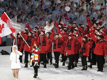 The host Canadian Olympic team led by Clara Hughes enters the stadium during the Opening Ceremony in Vancouver, BC Friday, February 12, 2010 during the 2010 Winter Olympics..(John Mahoney/Canwest News Service)  CNS-OLY-OPEN [PNG Merlin Archive]