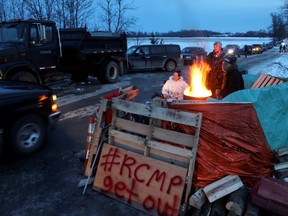 First Nations members of the Tyendinaga Mohawk Territory block train tracks servicing Via Rail, as part of a protest against British Columbia's Coastal GasLink pipeline, in Tyendinaga, Ontario, Canada February 12, 2020.