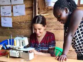 Designer Nicole Guzzo,  left, founder of Prakasa Co., working on a sewing project with Josephine in Uganda.