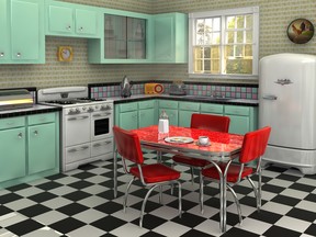 Retro kitchen from the 1950s complete with stove, refrigerator, chrome dinette set, percolator, toaster, bread box and radio.