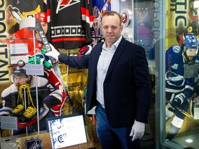 Emergency netminder David Ayres appears in front of the media at the Hockey Hall of Fame in Toronto on Friday as he donates his stick used in an NHL game between Toronto Maple Leafs and Carolina Hurricanes.