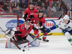 Elias Pettersson tried to get puck past Marcus Hogberg on Thursday.