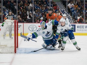 Anaheim Ducks forward Nick Ritchie (37) and Vancouver Canucks defenseman Troy Stecher (51) look as Anaheim Ducks forward Adam Henrique (14) scores on Vancouver Canucks goalie Thatcher Demko (35) in the second period during a game at Rogers Arena. Mandatory Credit: Bob Frid-USA TODAY Sports