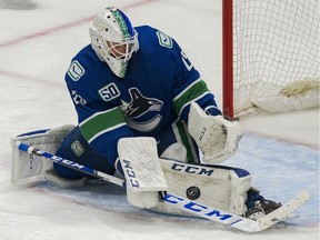 Feb 12, 2020; Vancouver, British Columbia, CAN; Vancouver Canucks goalie Jacob Markstrom (25) makes a save against the Chicago Blackhawks in the third period at Rogers Arena. Vancouver won 3 -0. Mandatory Credit: Bob Frid-USA TODAY Sports