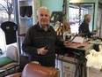 Dino Arvanitis, shears in one hand and a comb in the other, recently sold his Economy Barber Shop, but he won’t be ‘downing tools’ as he’ll continue to work part time.