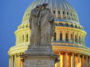 Statues on the Peace Monument near the U.S. Capitol where the Senate impeachment trial of President Donald Trump is going on in Washington, Jan. 31, 2020.