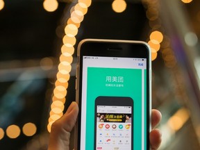 The preview page for the The Meituan application is displayed in the App Store on an Apple Inc. iPhone in an arranged photograph taken in Hong Kong, China, on Thursday, Sept. 6, 2018.