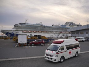 An ambulance drives away from the Diamond Princess cruise ship, operated by Carnival Corp., sitting docked in Yokohama, Japan, on Wednesday, Feb. 12, 2020.