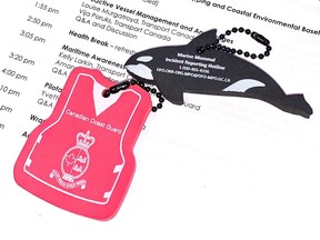 The federal government's Ocean Protection Plan members met in Vancouver to discuss how to cleanup the polystyrene foam in the ocean, but they handed out foam key chains.