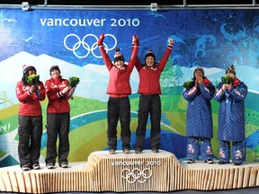 Canada’s Kaillie Humphries (left) and Heather Moyse were at the top of the Olympic podium at Whistler on Feb. 24, 2010 after winning the two-woman bobsleigh, and were joined by fellow Canadians Shelley-Ann Brown (far left) and Helen Upperton with their silver-medal performances.
