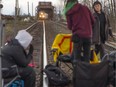Protesters against the Coastal GasLink pipeline block the tracks on the CP rail bridge in Port Coquitlam, British Columbia,