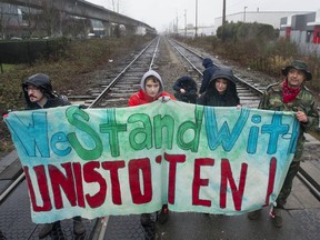 Approximately 100 people march in support of the Wet'suwet'en hereditary chiefs in their opposition to the GasLink pipeline project, along Grandview Highway in Vancouver Saturday, February 15, 2020. The protestors occupied the railway crossing on Renfrew Street between Grandview and Hebb Street.