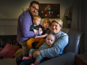 Mom Caryn and dad Danny with Annie (at centre), 5, Mae, 2, and Lucy, 5 months at their home in Vancouver.