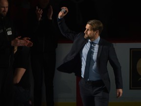 Markus Naslund waves to the crowd before Monday's night's Vancouver Canucks game. Former Canucks captains, Stan Smyl, Trevor Linden and Naslund were honoured during Canucks Legends Night at Rogers Arena in Vancouver.