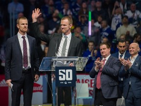 Henrik and Daniel Sedin have their jerseys retired before the Vancouver Canucks play the Chicago Blackhawks in NHL league play at Rogers Arena in Vancouver, BC, February 12, 2020.