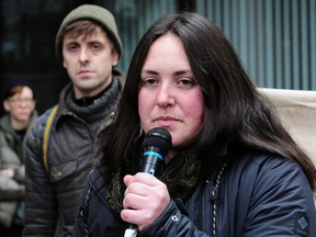 Protest organizer Natalie Knight in acton as anti-pipeline protesters block a downtown intersection and at the same time announce they are launching a legal challenge to the port authority's injunction, in Vancouver, BC.