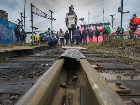 VANCOUVER, B.C.: February 23, 2020 – Protesters block a rail line at Venables and Glen Drive in Vancouver, BC, February 23, 2020. Protesters standing in solidarity with the Wet'suwet'en hereditary chiefs who are fighting the Coastal GasLink project in their territory in northern B.C.