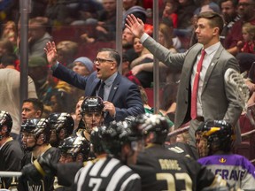 Vancouver Warriors' coach Chris Gill, centre, and assistant coach Clayton Richardson, right, again had their hands full against the Seals on Saturday in National Lacrosse League action in San Diego, Calif.