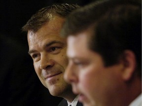 Vancouver Canucks' GM Dave Nonis, right, announced Alain Vigneault as the new head coach on June 20, 2006.