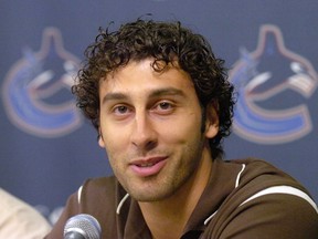 Vancouver Canucks general manager Dave Nonis introduced his two new acquisitions, defenceman Willie Mitchell and goalie Roberto Luongo, pictured, at a news conference at GM Place on July 4, 2006.