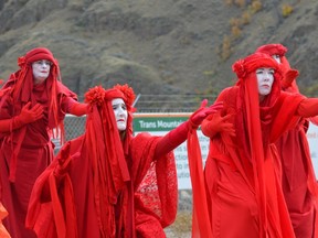 Bronwen Boulton-Scott, Debbie Mowat, Katie Welch and Shelly McKerchar lead a group of seven dancers in a Red Brigade protest against the Trans Mountain pipeline twinning project in Kamloops on Oct. 7, 2019.