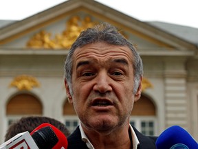 Romanian lawmaker and soccer club owner George "Gigi" Becali talks to the media in Bucharest April 17, 2012.