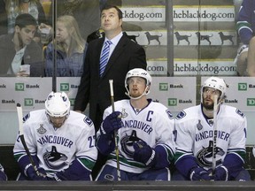 Former Vancouver Canucks head coach Alain Vigneault knew immediately that he had something special in Henrik and Daniel Sedin (centre).