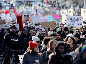 Supporters of the indigenous Wet'suwet'en Nation march as part of a protest against British Columbia's Coastal GasLink pipeline, in Toronto, Ontario, Canada February 17, 2020.